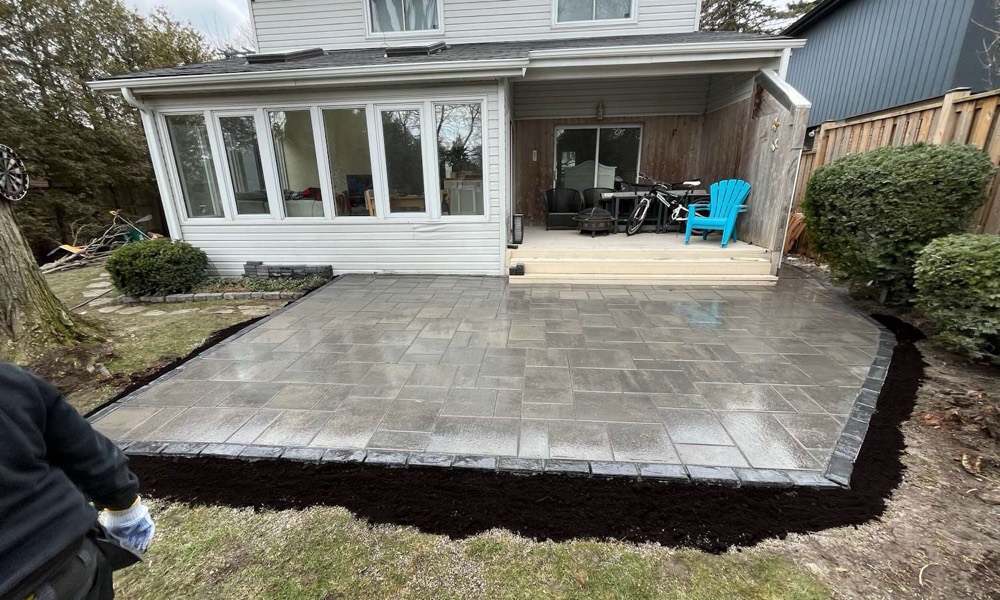 Detached home with a dark shingle roof at a completed Pristine project